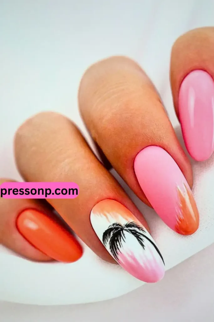 "Natural-length almond nails featuring a chic tropical sunset theme. The design includes a mix of solid bubblegum pink and vibrant orange nails, with a white accent nail showcasing a hand-painted black palm tree silhouette and pink-orange watercolor strokes. A pink 'pressonp.com' watermark is visible on the side."