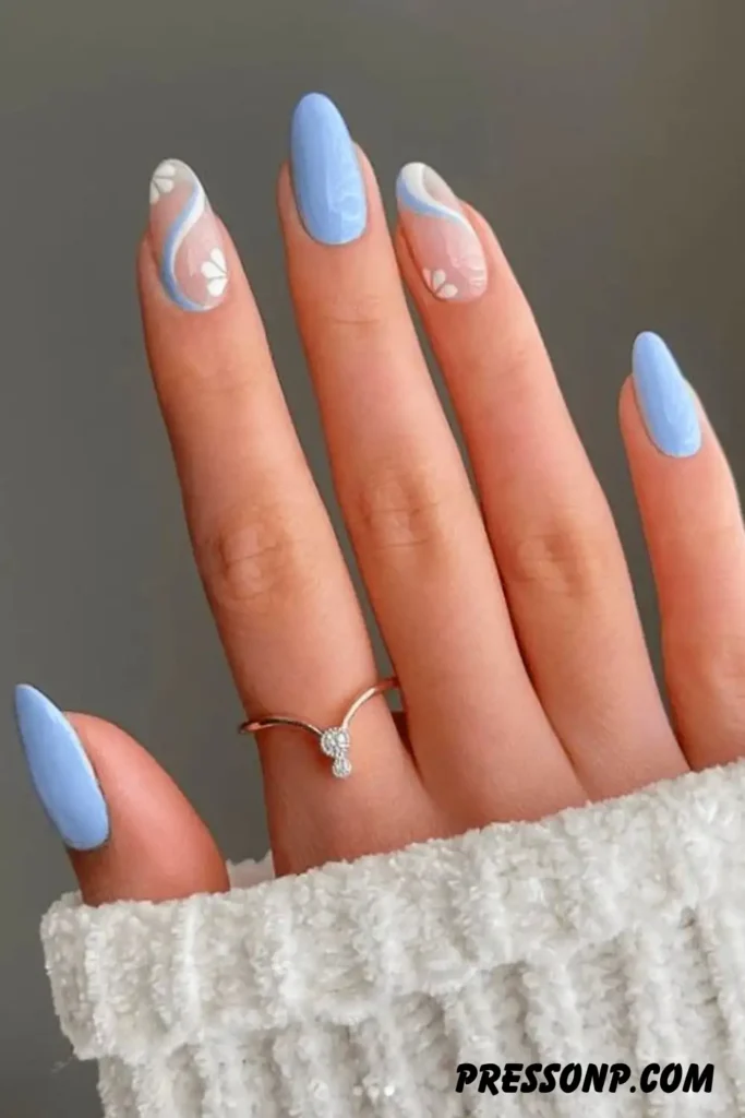 A close-up of long oval nails displaying a sophisticated skittle gradient of warm neutral tones, from pale cream to rich taupe, finished with a subtle metallic glaze chrome overlay.