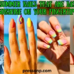 A four-panel collage of vibrant neon summer manicures including matte pink and orange stiletto nails, colorful beach-themed patterns, rainbow French tips, and lime green almond nails. Overlay text reads: "Neon Summer Nails That Are Basically Sunshine on Your Fingertips."