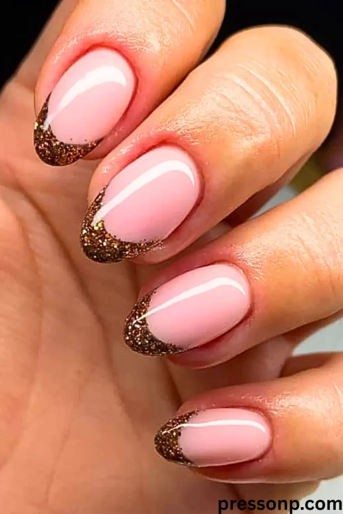 A close-up of long, square-shaped nails featuring a soft lavender base with a delicate silver glitter gradient fading down from the tips.