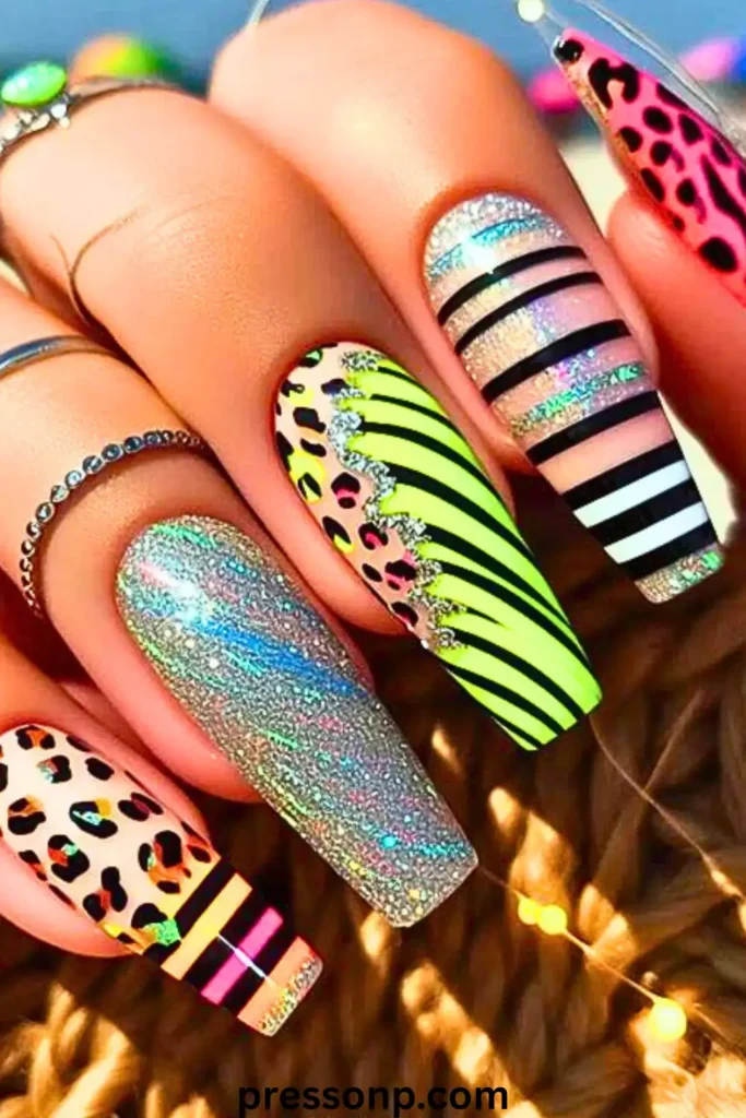 "A vibrant maximalist manicure on long coffin nails featuring a mix of neon yellow, hot pink, and black patterns. The design includes leopard print, bold diagonal stripes, and holographic silver glitter accents. This high-contrast look demonstrates how bright nails serve as a primary fashion accessory. Watermarked with pressonp.com at the bottom."