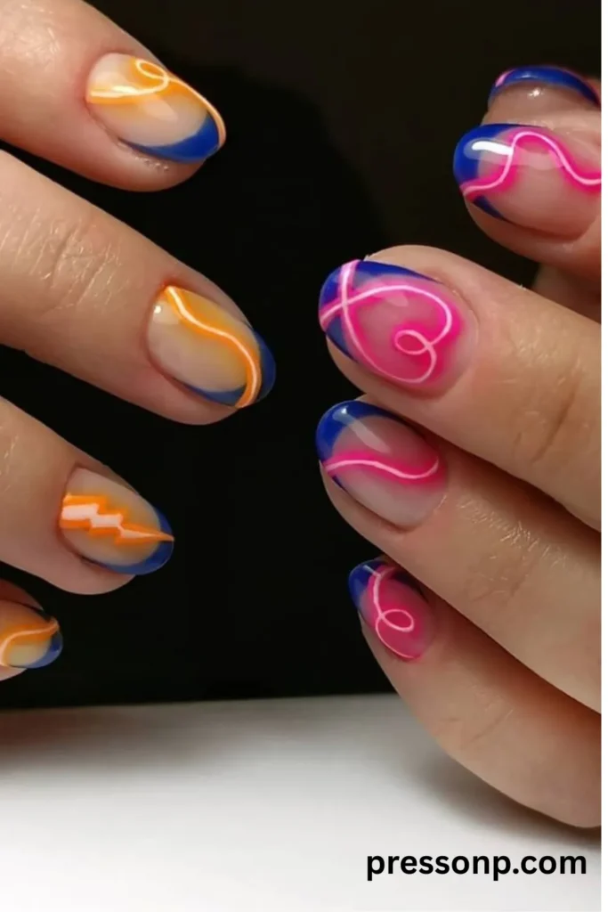 Transparent almond nails with cobalt blue French tips and abstract neon orange and hot pink swirls.