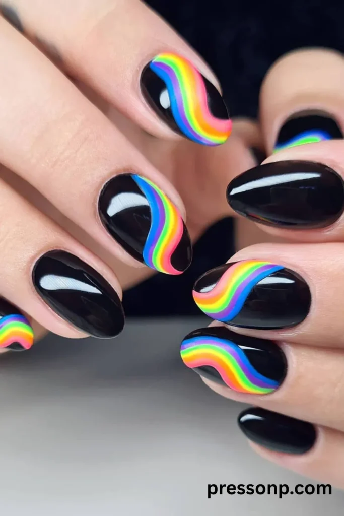 Glossy black oval nails featuring a striking, wavy abstract ribbon of neon rainbow colors down the center.