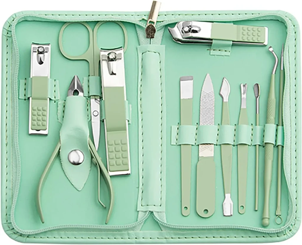 An open, travel-friendly manicure and pedicure grooming kit inside a zippered mint green faux-leather case, neatly organizing an assortment of matching mint-and-stainless-steel nail clippers, scissors, files, and cuticle tools.